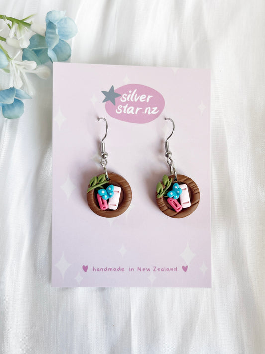 Handmade polymer clay earrings featuring miniature Japanese miso soup bowls with green onions, tofu, and chopsticks are presented on a branded silverstar.nz card, marked handmade in New Zealand.