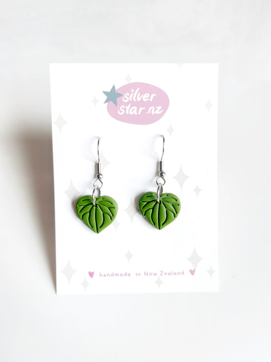 Kawakawa Polymer Clay Earrings with stainless steel hooks are displayed on a silverstar.nz card featuring a subtle star and sparkle design, and proudly stating handmade in New Zealand.